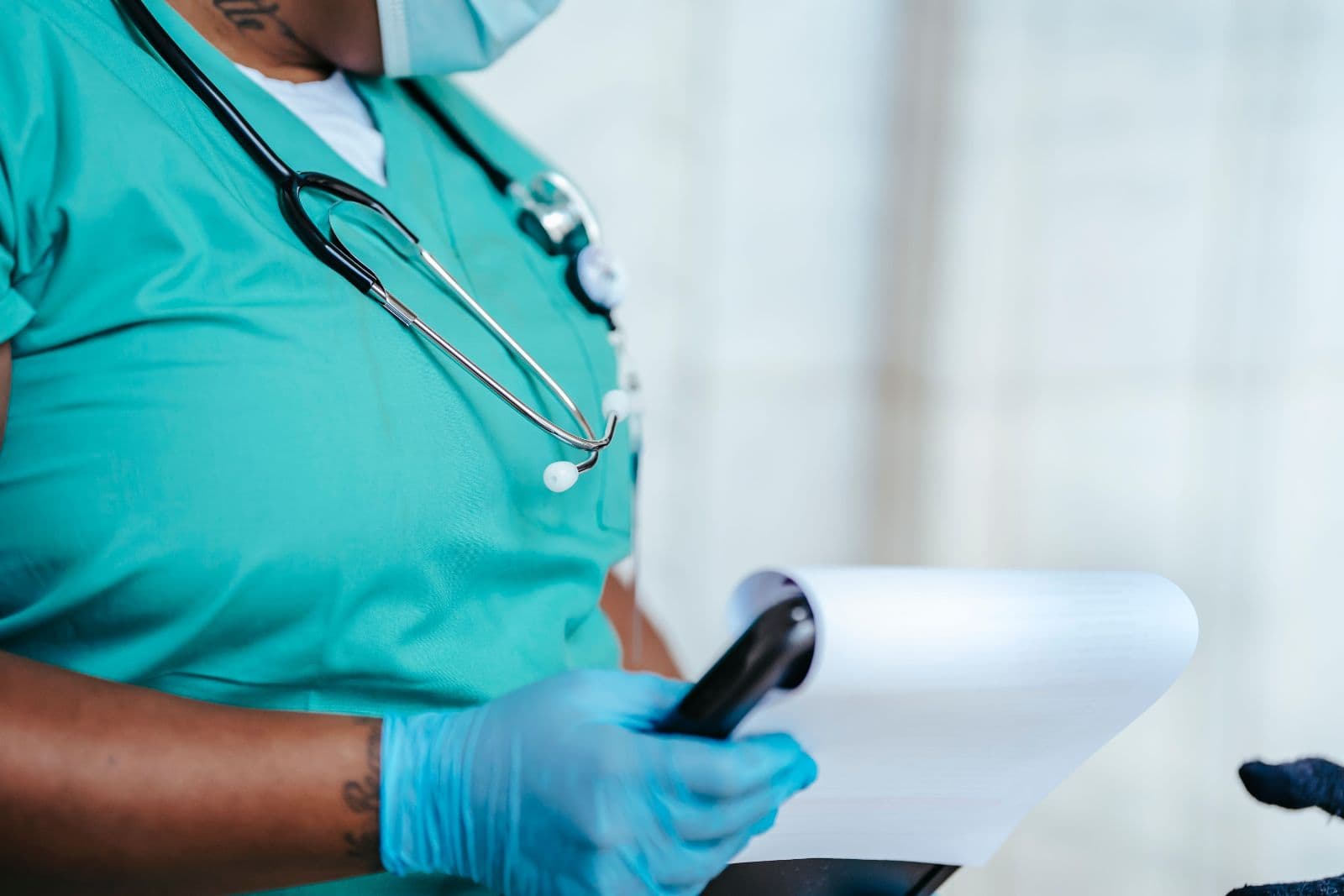 A nurse completing clinical paperwork
